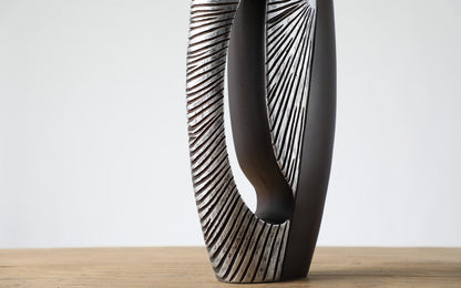 Modern sculptural, tribal-inspired, and contemporary luxury,Asymmetrical, Openwork Design