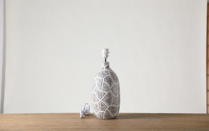 Rustic, organic, and bohemian-inspired design Textured, Carved Base, lamp