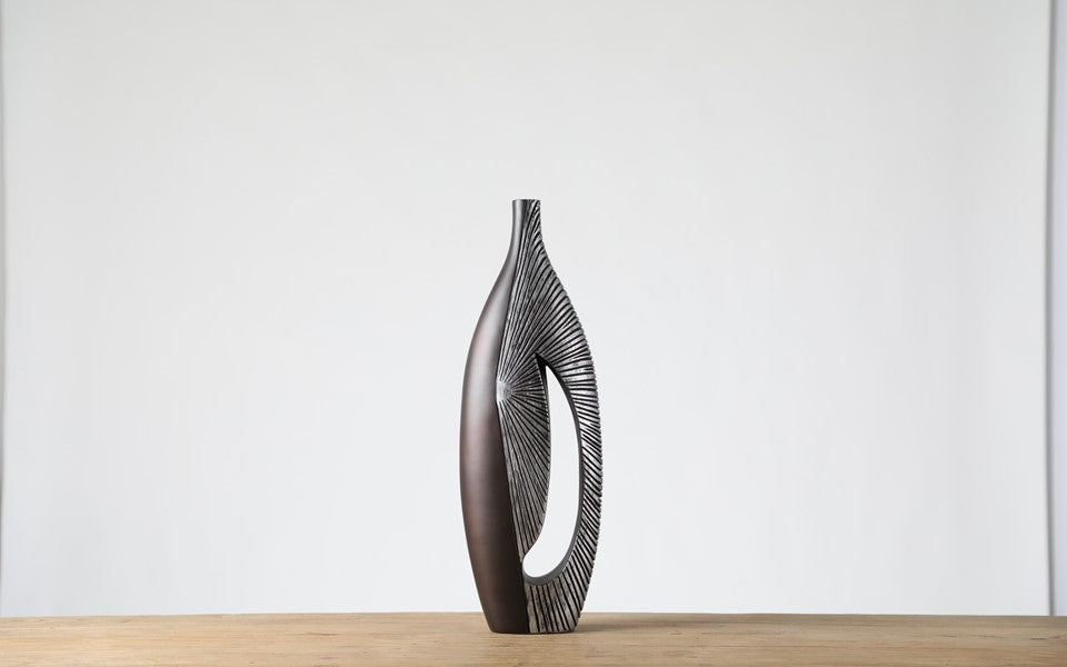 Modern sculptural, tribal-inspired, and contemporary luxury,Asymmetrical, Openwork Design