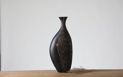 Modern tribal, sculptural, and contemporary luxury,Asymmetrical, Flowing Silhouettes, vase
