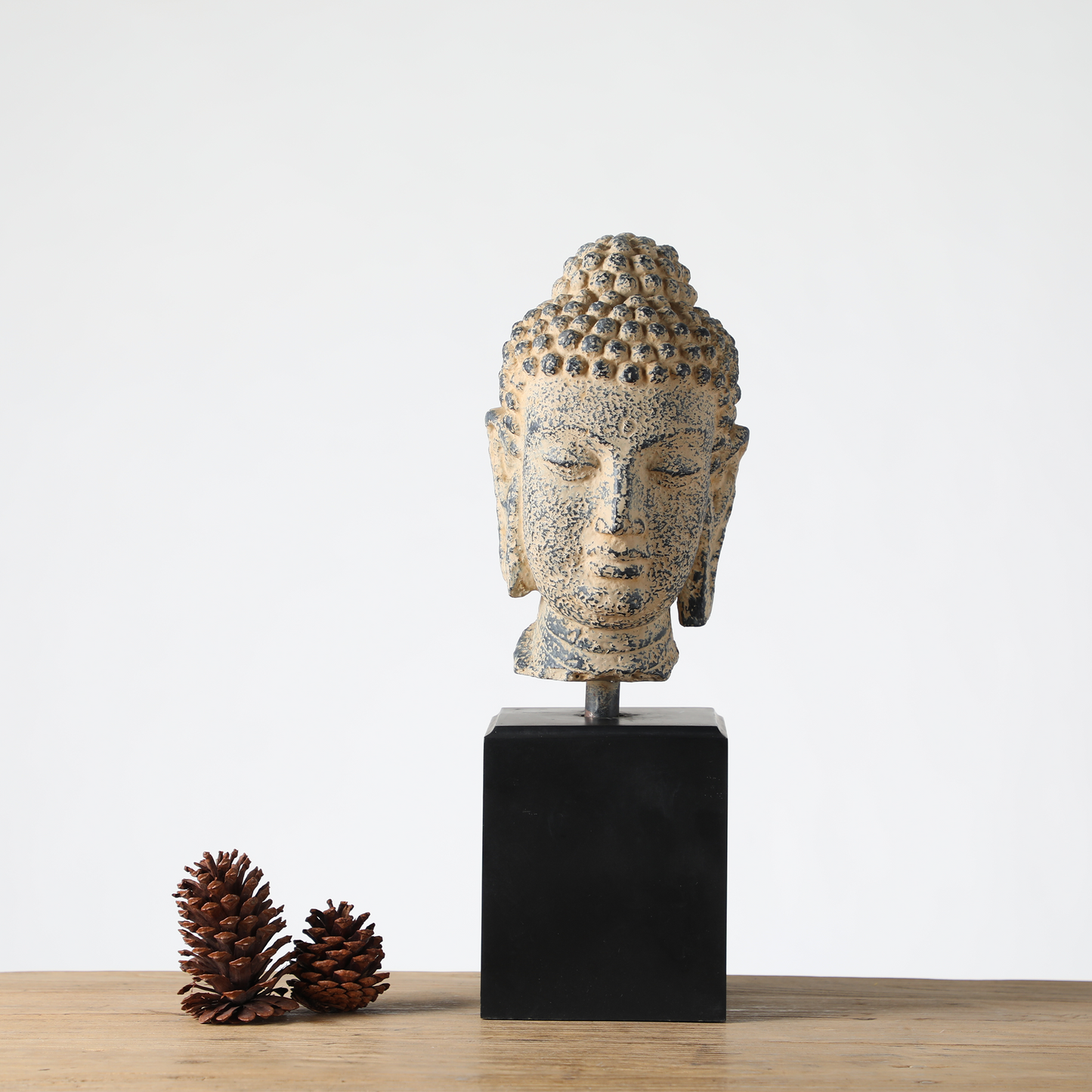 Buddha head sculpture on a stand, Zen, Asian-inspired, and Rustic décor styles,