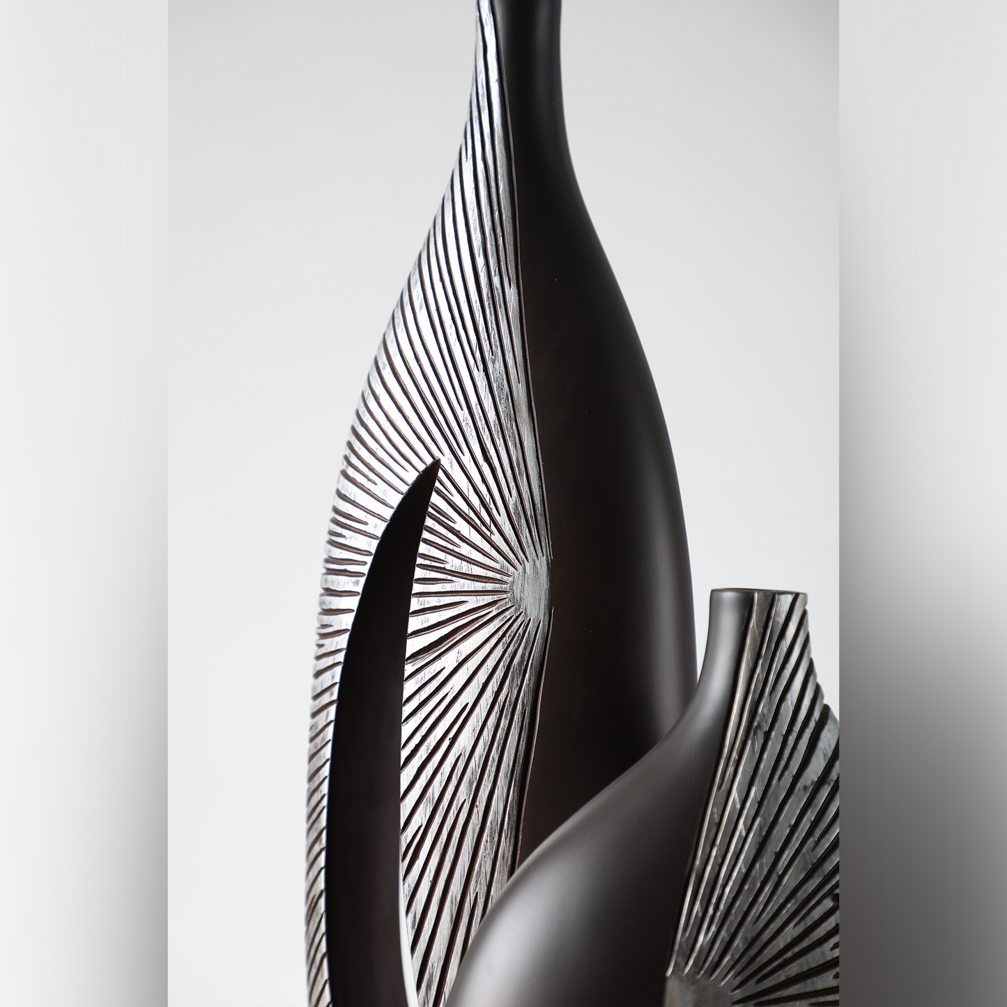 Modern sculptural, tribal-inspired, and contemporary luxury,Asymmetrical, Openwork Design