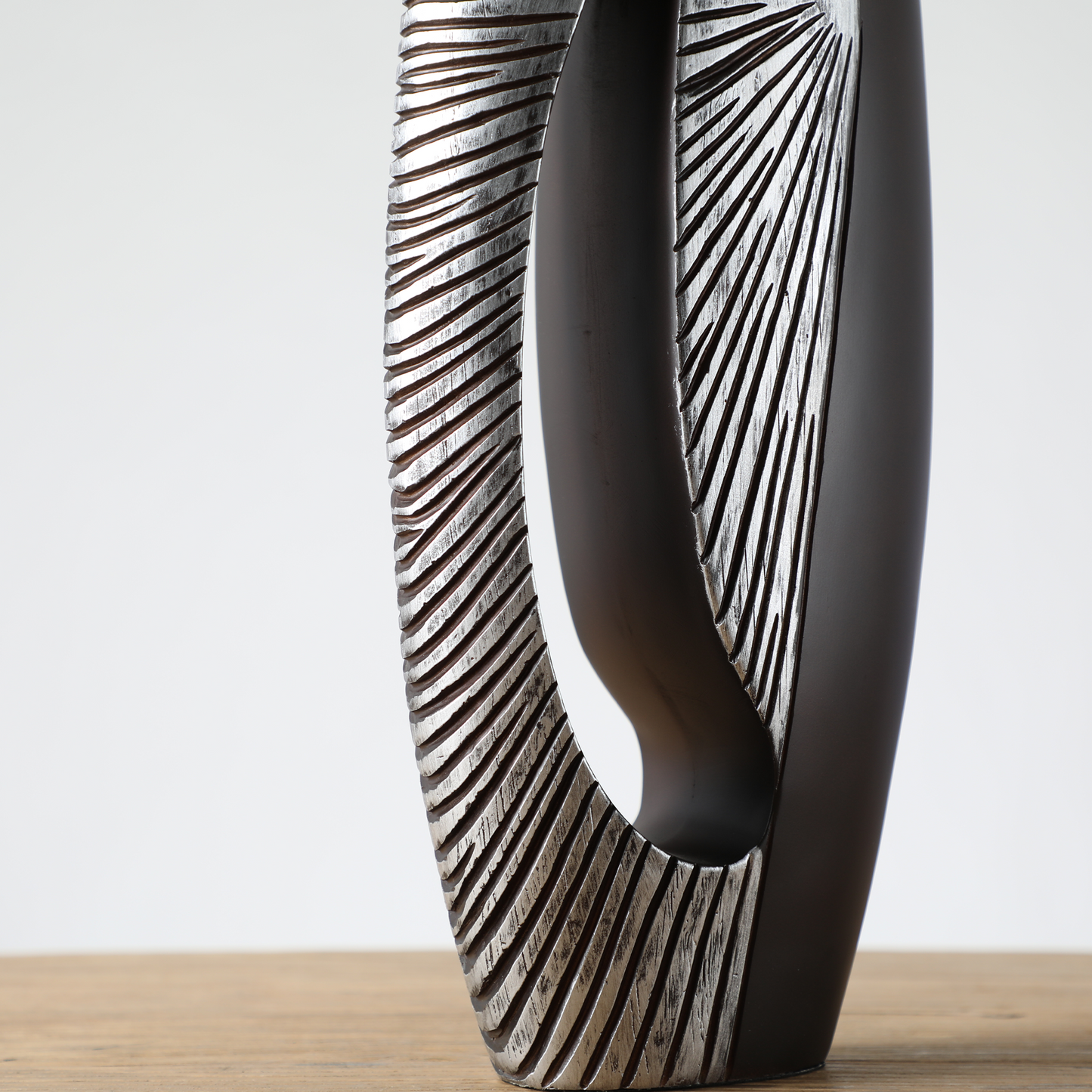 Modern sculptural, tribal-inspired, and contemporary luxury,Asymmetrical, Openwork Design