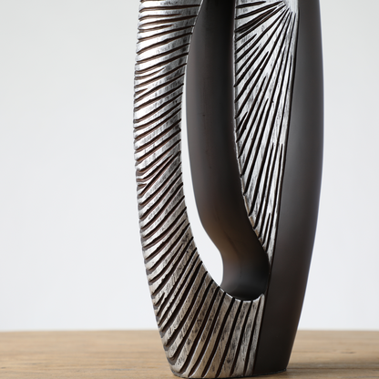 Modern sculptural, tribal-inspired, and contemporary luxury,Asymmetrical, Openwork Design