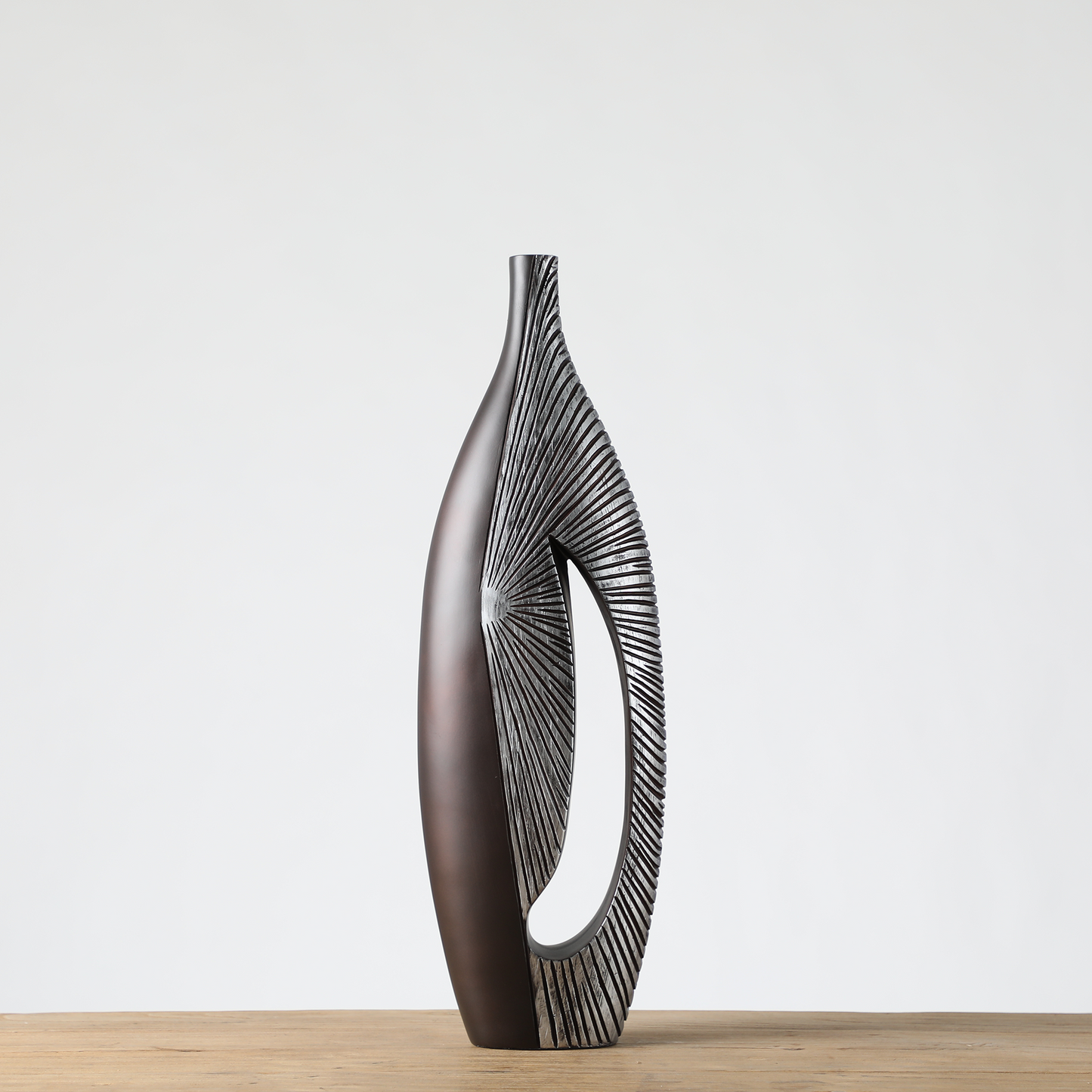 Modern sculptural, tribal-inspired, and contemporary luxury,Asymmetrical, Openwork Design