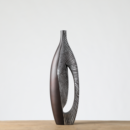 Modern sculptural, tribal-inspired, and contemporary luxury,Asymmetrical, Openwork Design