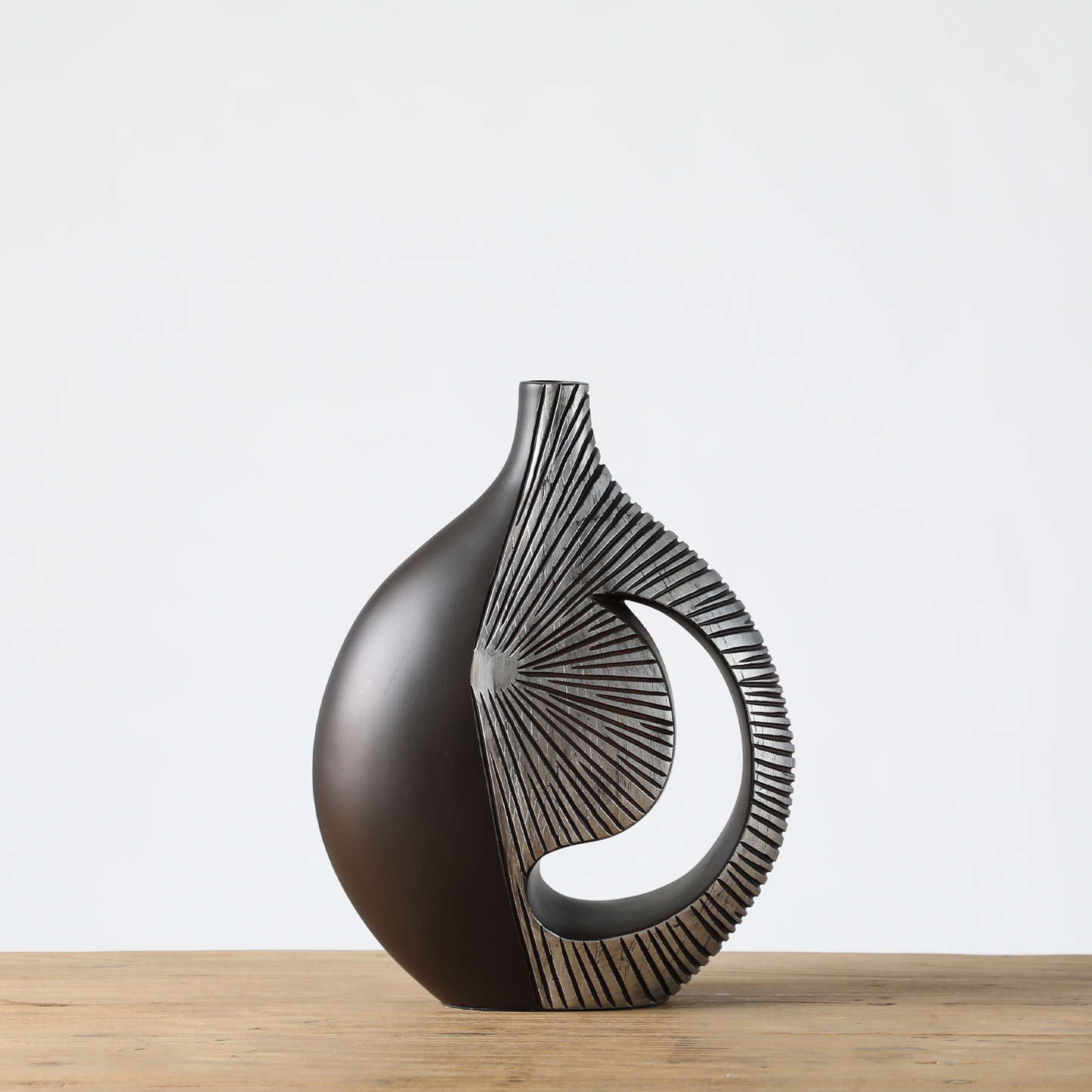 Modern sculptural, tribal-inspired,contemporary luxury,Asymmetrical, Openwork Design