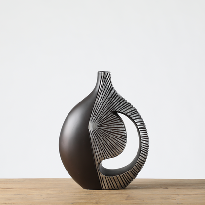 Modern sculptural, tribal-inspired,contemporary luxury,Asymmetrical, Openwork Design